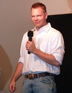 Jim Parrack holding a microphone at 2011 Bitten Convention.