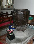 Font, carved from one piece of wood