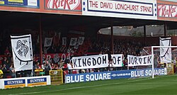 One of the stands of the Bootham Crescent association football ground, with holding up banners