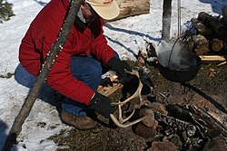 Demonstration of Native American technique of making maple sugar