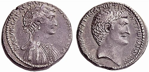 A silver coin depicting the heads of Cleopatra and Mark Antony