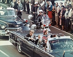 John F. Kennedy Jr. and Jacqueline Kennedy as seen from above in their vehicle prior to his asssassination