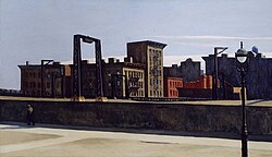 A cityscape with buildings and a bridge structure