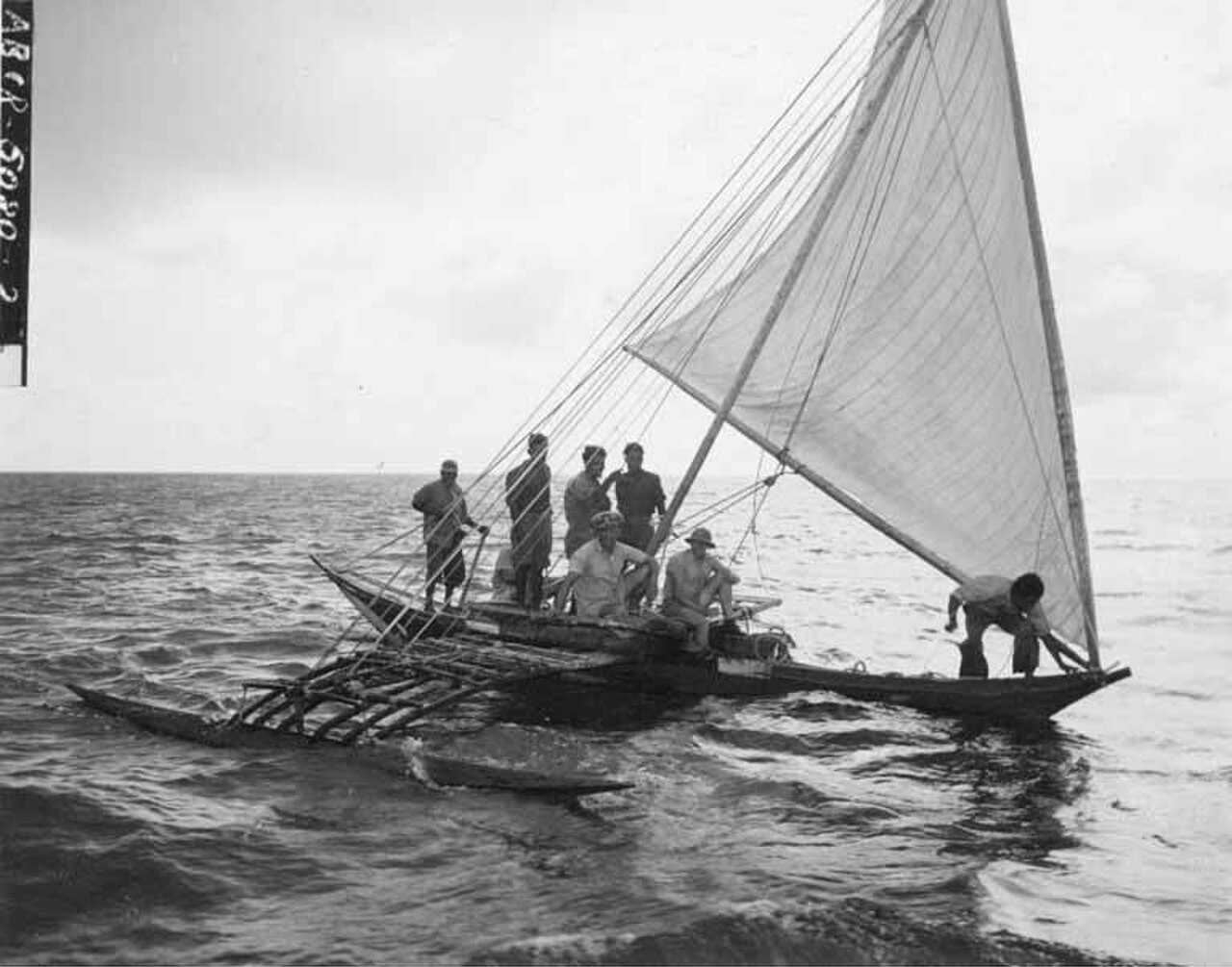 Natives and members of resurvey party in a canoe, Rongerik Island, summer 1947 (DONALDSON 142).jpeg