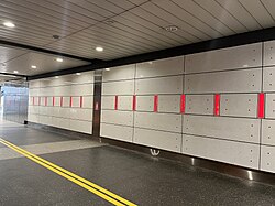 Artwork on the concourse wall as described in the following paragraph