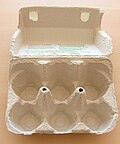 A pulp egg carton using a living hinge