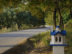 Road with small church near Dikella