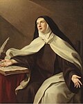 St. Teresa of Avila, wearing a Carmelite habit, holds her open hand on the pages of a book, next to her white quill pen.
