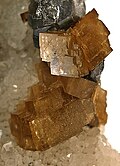 Siderite crystals with galena and quartz. Size: 6.2 cm × 4.1 cm × 3.6 cm (2.4 in × 1.6 in × 1.4 in)