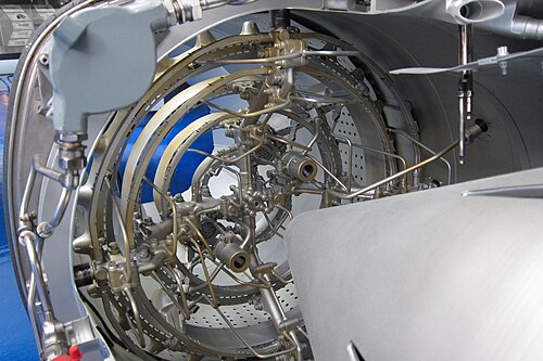 This view almost in-line with the gas flow path shows all the obstructions responsible for part of the total pressure loss in an afterburner. Downstream, beyond the flameholders, is the burning length of duct where pressure loss occurs with heat addition.
