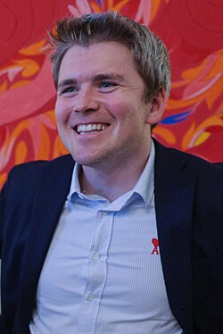 Collison sitting on-stage at Web Summit