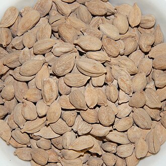 White cardamom pods in a bowl