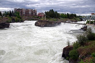 The Spokane River rushes past Snxw Meneɂ island in Riverfront Park