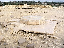 Huge limestone blocks on the ground, in the shape of Egyptian hieroglyphs