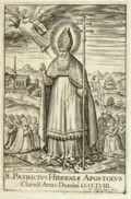St. Patrick, wearing a bishop’s cope and mitre, holds a crozier while giving a blessing, as snakes slither away.