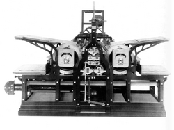 Technical drawing of a steam-powered printing press with cylinders and a flat bed