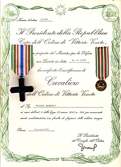 "Number of Order 11996/ The President of the Republic/ Head of the Order of Vittorio Veneto/ on proposal of the Minister of Defence/ with Decree dated 16.06.1973/ has conferred the honour of/ Knight /of the Order of Vittorio Veneto/ on Mr. Arnolfo Mugnai /in accordance with Art. 4 of the Law No. 263 of 18 March 1968 in recognition of/ merit for combat, with right to bear the relative insignia/ Rome, 16.06.1973/ (Signed) the President of the Council of the Order."