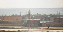 A local walks down the streets of Ayn Issa.