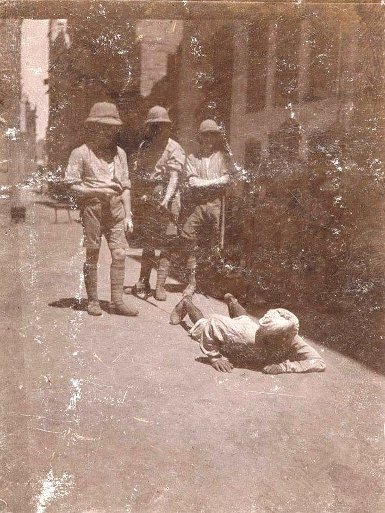Native crawling up street where Miss Sherwood was assaulted 1919.jpg